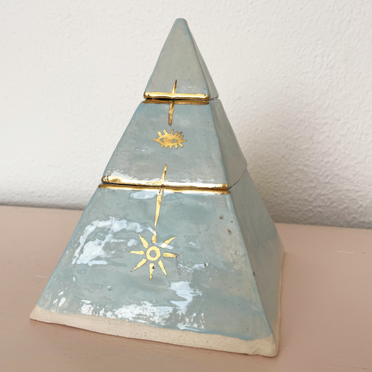 Handcrafted ceramic pyramid urn with two separate compartments.